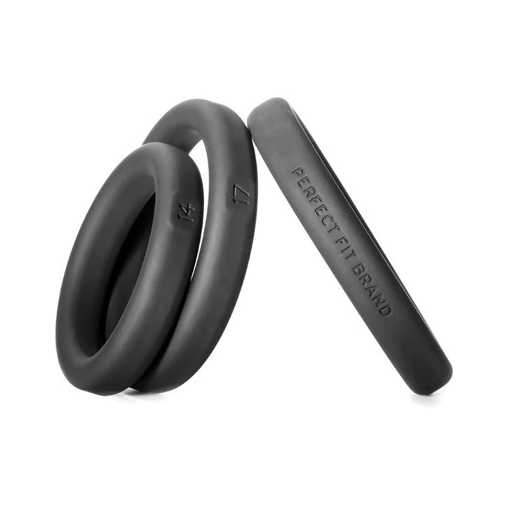 Set of three black silicone rings in small, medium, and large sizes with size markings and brand name embossed.
