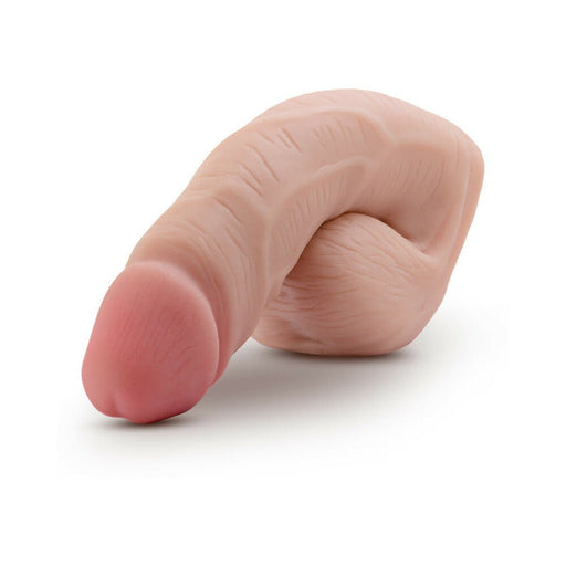 Vanilla beige 5-inch packer dildo with realistic texture and subtle pink head, designed for natural masculine bulge.