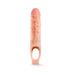 Vanilla-colored 9 inch textured penis extender sheath with ball strap for secure fit and enhanced sensation.