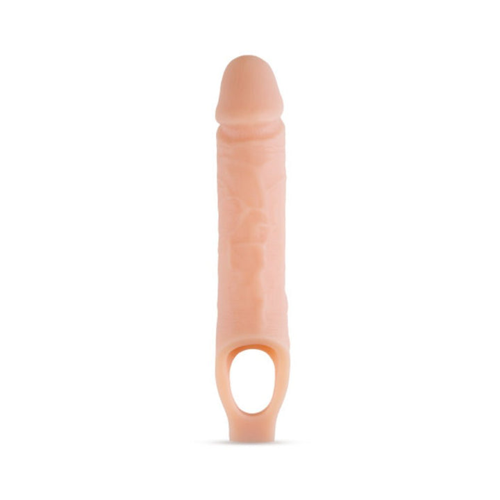 Vanilla-colored 10 inch silicone penis extender sheath with ball strap for secure fit and realistic texture.