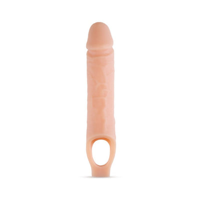 Vanilla-colored 10 inch silicone penis extender sheath with ball strap for secure fit and realistic texture.