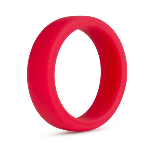 Red silicone cock ring with a smooth, flat design for comfortable and secure wear.