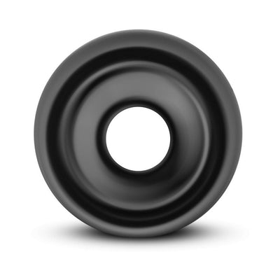 Black universal replacement pump sleeve made of smooth TPE material with a central opening and rounded edges.