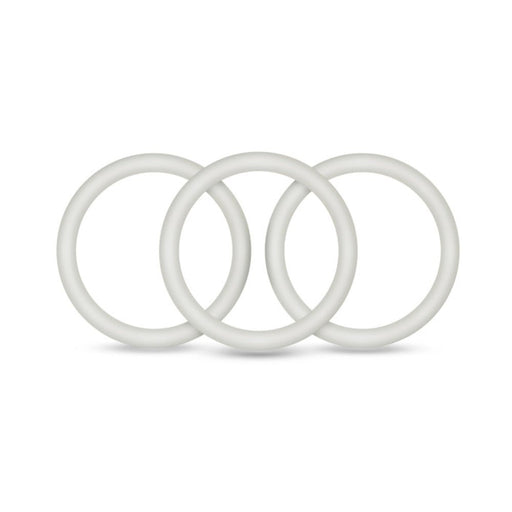 Set of three medium-sized pure white silicone cock rings arranged side by side on a white background.
