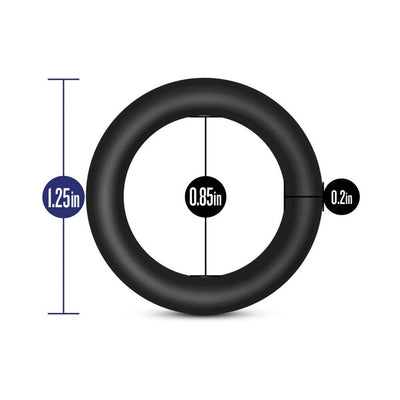 Black silicone cockring with dimensions showing 1.25 inch outer diameter, 0.85 inch inner diameter, and 0.2 inch thickness.