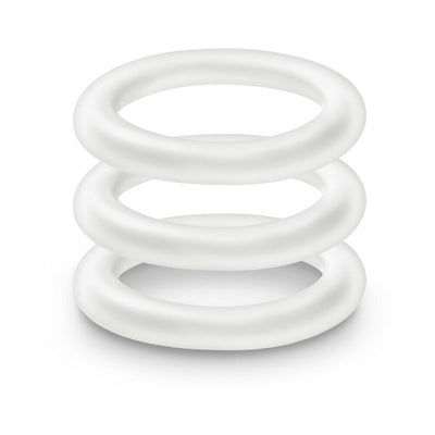 Three stacked white silicone cock rings with a smooth, flexible design on a white background.