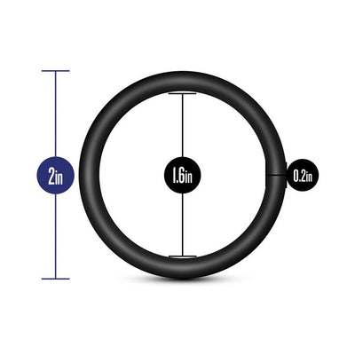 Black silicone cock ring with dimensions 2 inch outer diameter, 1.6 inch inner diameter, and 0.2 inch thickness.