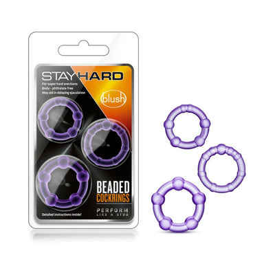Three purple beaded stretchy cock rings displayed next to their black and orange Blush Stay Hard packaging.