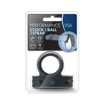 Black silicone cock and ball strap in clear retail packaging with product details and illustration.
