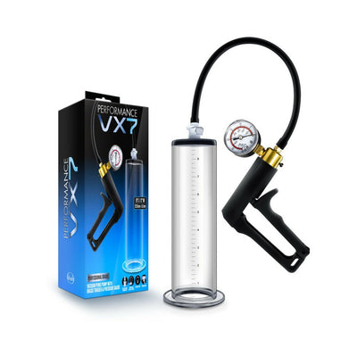 Clear Performance VX7 vacuum penis pump with brass trigger, pressure gauge, and black hose next to product packaging.