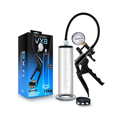 Performance VX8 premium clear penis pump system with silicone strap and pressure gauge next to product packaging.
