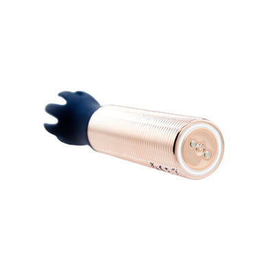 Navy silicone tickler head attached to a rose gold mini bullet massager with power button on base, shown on white background.