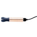 Navy silicone tickler head attached to rose gold mini massager with USB charging cable connected.