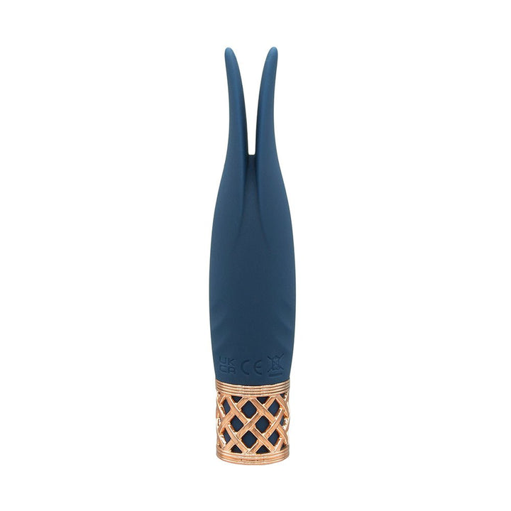 Compact navy blue silicone clitoral vibrator with dual flexible tips and rose gold lattice base detail.