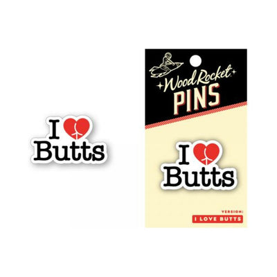 Soft enamel pin with "I Love Butts" text and a red heart-shaped design, shown on packaging and separately.