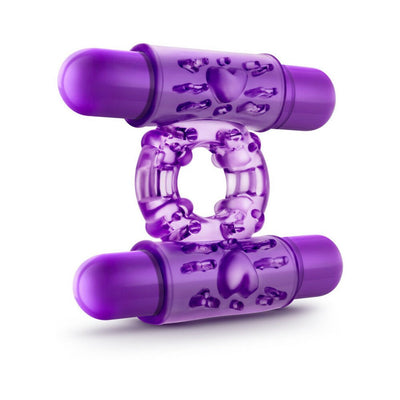 Purple dual vibrating cock ring with textured surface and two bullet vibrators for enhanced pleasure.