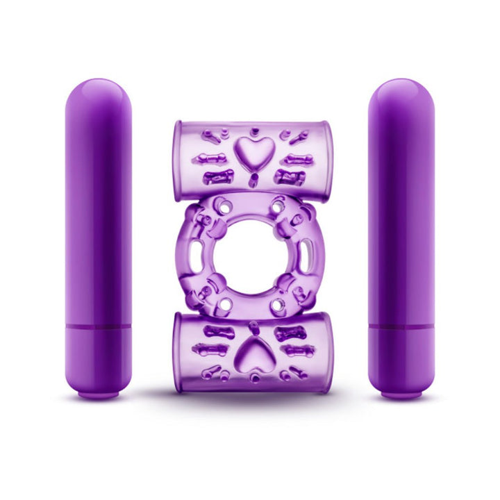 Purple dual vibrating cock ring with two removable bullet vibrators and textured silicone design.