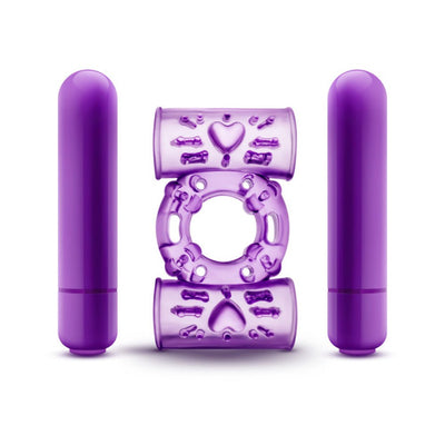 Purple dual vibrating cock ring with two removable bullet vibrators and textured silicone design.