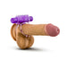 Purple vibrating double strap cockring displayed on a realistic penis model against a white background.