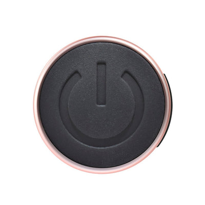 Close-up of the Playboy Afternoon Delight G-spot vibrator power button with rose gold trim.