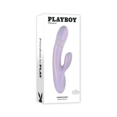 Playboy Bumping Bunny rechargeable lavender silicone dual stimulation vibrator in product packaging box.