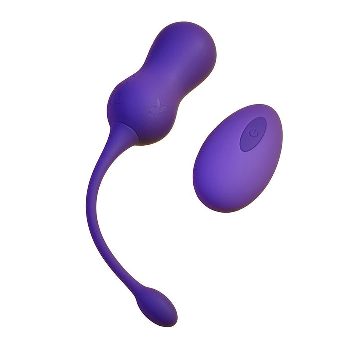 Purple silicone dual Kegel balls with long retrieval cord and matching remote control.