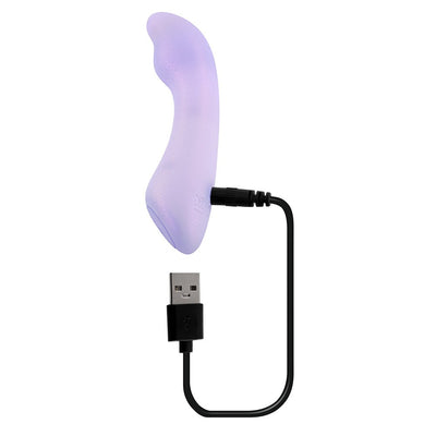 Opalescent lavender silicone G-spot vibrator with USB charging cable connected, curved ergonomic design.