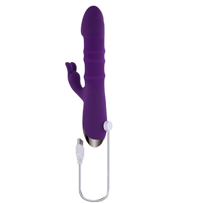 Purple rechargeable silicone dual stimulation vibrator with USB charging cable on white background.