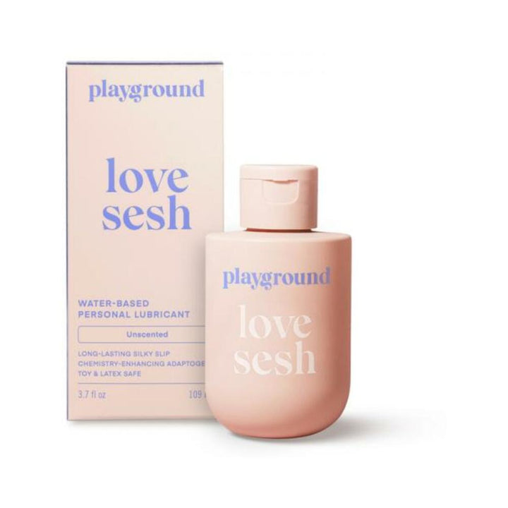 Playground Love Sesh water-based personal lubricant in a soft pink bottle with matching box, featuring blue and white text.