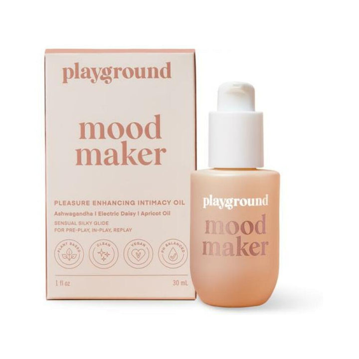 Playground Mood Maker intimacy oil in a frosted bottle with matching soft pink box packaging.