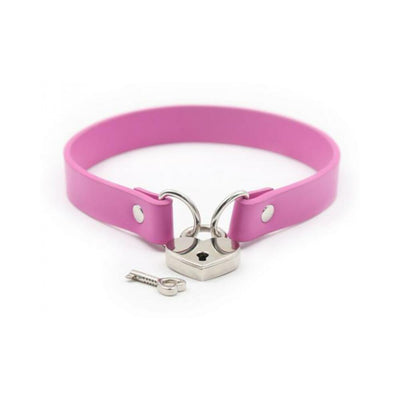 Pink PVC collar with silver heart-shaped lock and matching key on white background