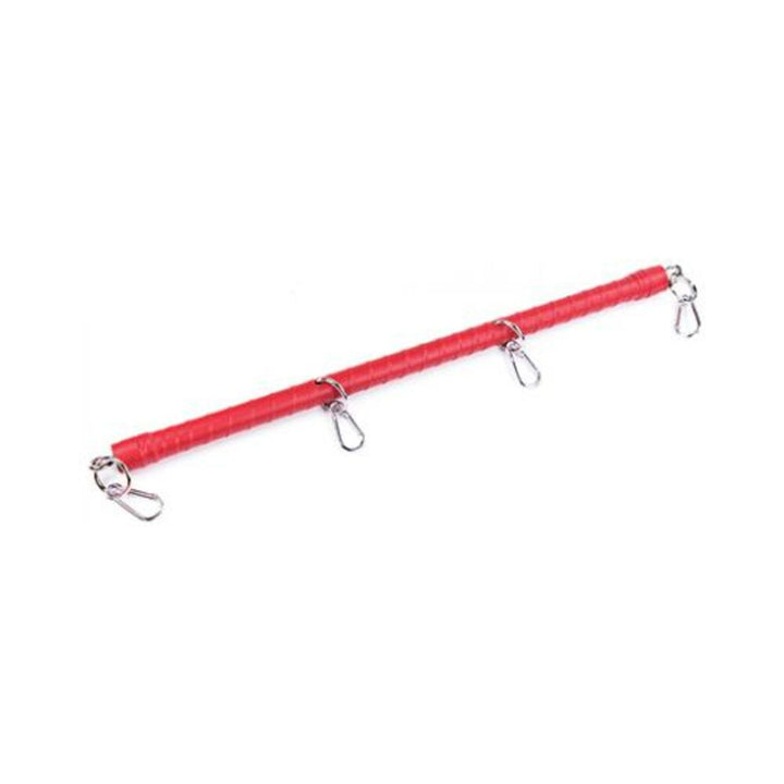 Red PVC-wrapped spreader bar with four metal clips for secure attachment to wrist or ankle cuffs.