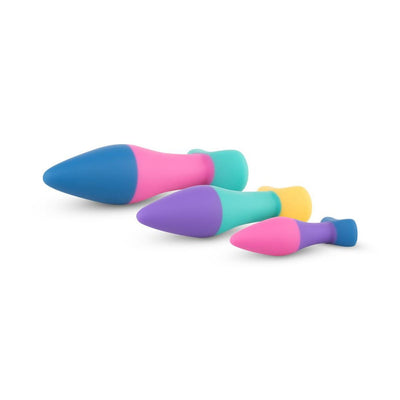 Set of three colorful silicone butt plugs in small, medium, and large sizes with tapered shapes and flat bases.