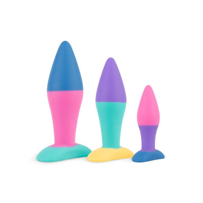 Set of three colorful silicone butt plugs in small, medium, and large sizes with tapered shapes and flat bases.