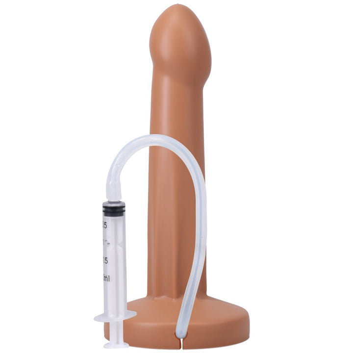 Honey-colored silicone dildo with a suction base and attached clear syringe and tube for squirting feature.