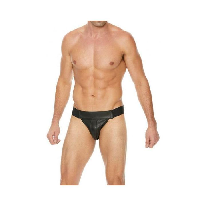 Male model wearing a black premium leather jockstrap with a plain front and elastic waistband.