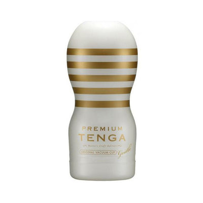 White and gold Premium Tenga Original Vacuum Cup Gentle with horizontal stripes and ergonomic shape.
