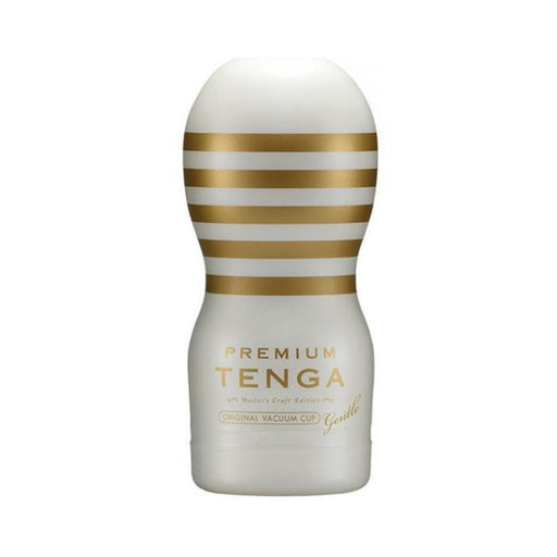 White and gold Premium Tenga Original Vacuum Cup Gentle with horizontal stripes and ergonomic shape.