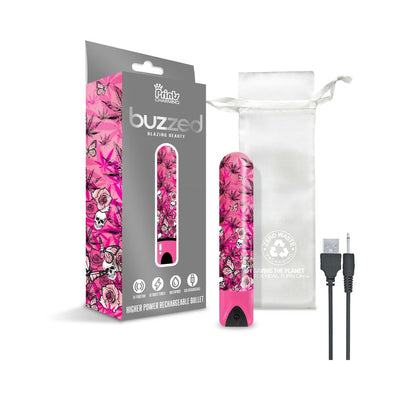 Pink rechargeable bullet vibrator with cannabis and floral print, USB charging cable, and white storage pouch.
