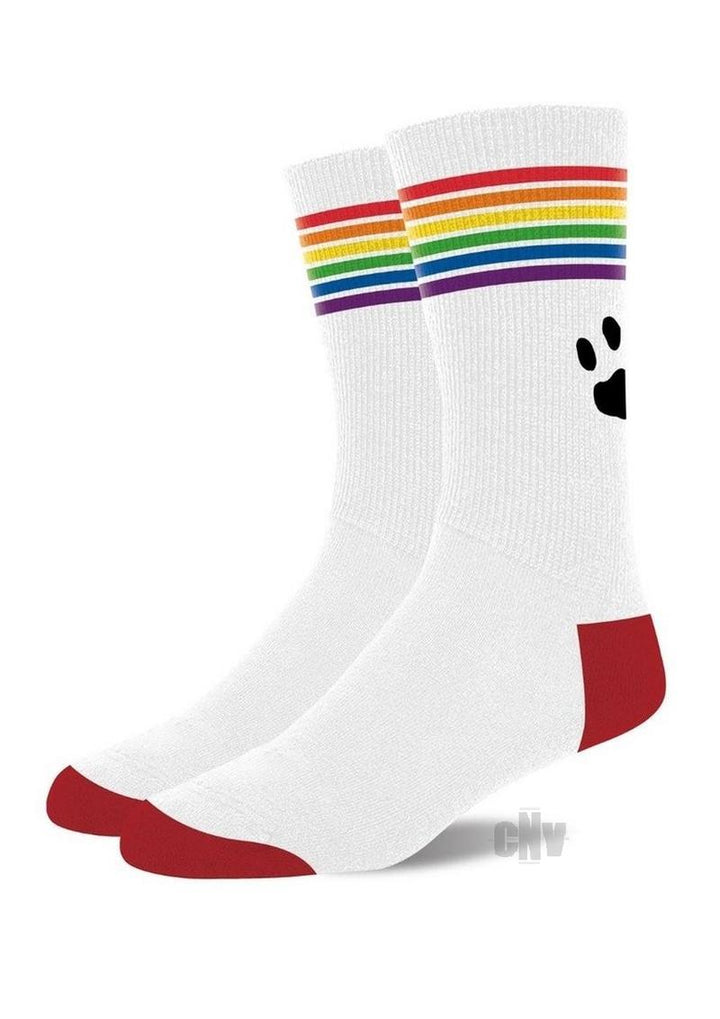 White crew socks with rainbow stripes at the top, red toe and heel accents, and a black paw print logo.