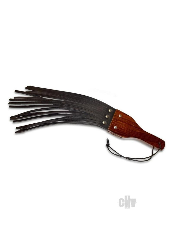 Black leather fringe paddle with polished wooden handle and wrist strap on white background
