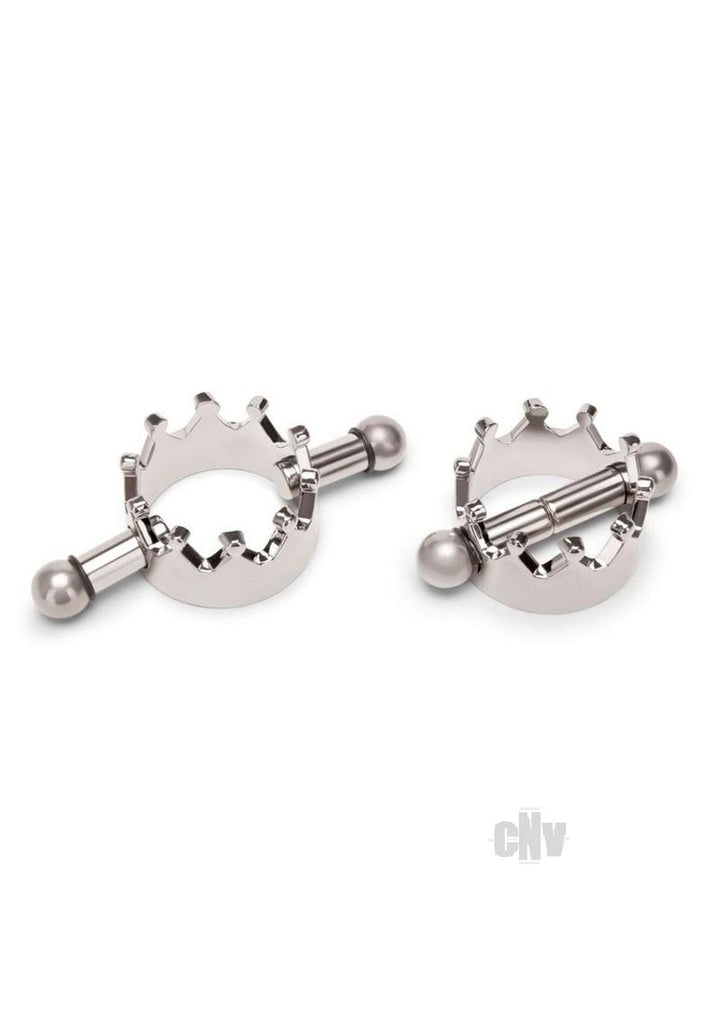 Pair of silver magnetic nipple clamps with crown-shaped design and smooth rounded ends on a white background.