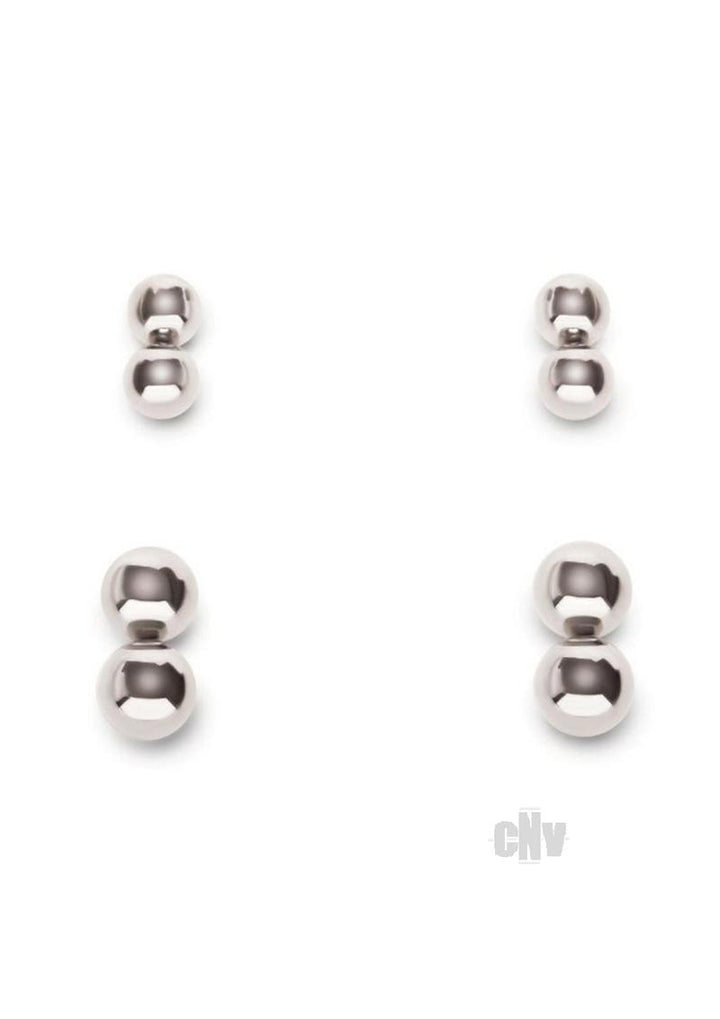 Set of four polished silver magnetic orbs in two different sizes for gentle stimulation and grip.