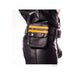 Black leather pouch wallet with yellow stripes attached to a matching leather belt on a person wearing black leather pants.