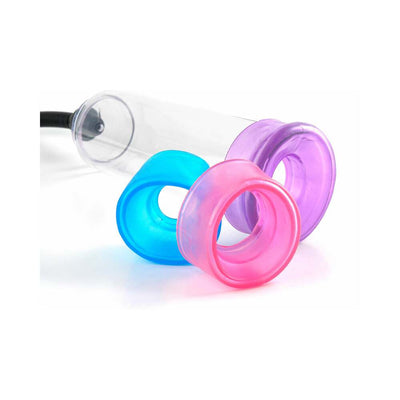 Clear vacuum pump cylinder with three colorful soft silicone sleeves in blue, pink, and purple for gradual training.