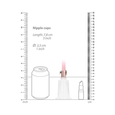 Clear nipple cup from Pumped set shown with size comparison to a soda can and lipstick, with measurement scales in inches and centimeters.