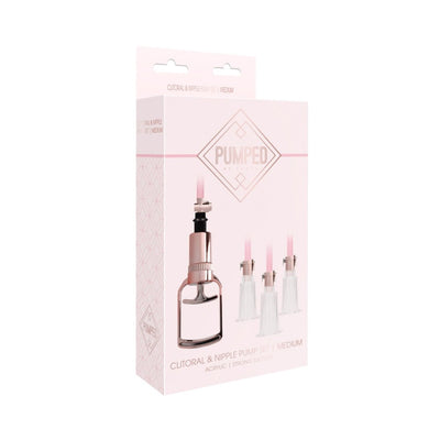 Rose gold clitoral and nipple pump set in medium size with three clear acrylic cups and hand pump in elegant packaging.
