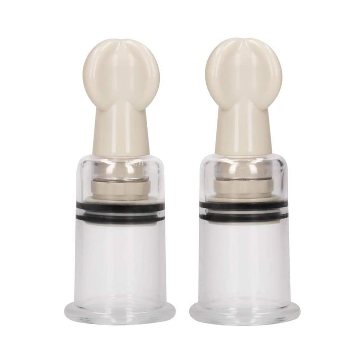 Pair of transparent medium-sized nipple suction cups with beige twist tops for adjustable stimulation.