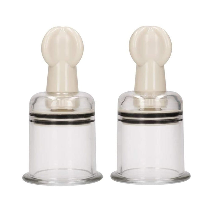 Pair of large transparent nipple suction cups with beige twist tops for adjustable stimulation