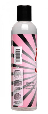 Clear 8.25oz bottle of Pussy Juice Vagina Scented Lube with pink and black label, highlighting glycerin and paraben-free formula.